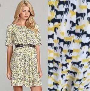 Flattering pleaded short sleeve horse print dress